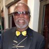Profilbild von JOHN KANI OIS OBE